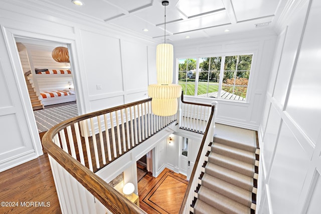 20 Conover Ln, Rumson, NJ 07760 - stairway featuring a decorative wall, visible vents, coffered ceiling, recessed lighting, and wood finished floors