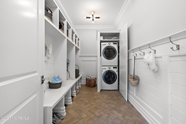 20 Conover Ln, Rumson, NJ 07760 - laundry room featuring stacked washing maching and dryer, crown molding, a wainscoted wall, and laundry area