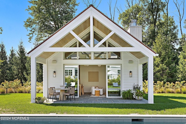 20 Conover Ln, Rumson, NJ 07760 - rear view of house featuring a chimney, a yard, and a patio area