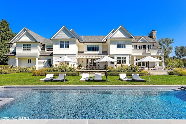 20 Conover Ln, Rumson, NJ 07760 - rear view of house with a chimney, a gazebo, a lawn, and an outdoor pool