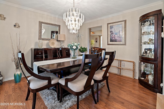 1107 Frontage Rd, Toms River, NJ 08753 - dining room featuring baseboards, wood finished floors, a chandelier, and ornamental molding