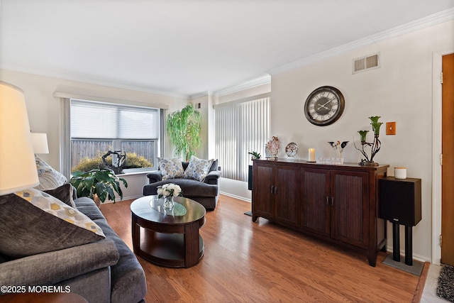 1107 Frontage Rd, Toms River, NJ 08753 - living room with visible vents, baseboards, light wood-style floors, and crown molding