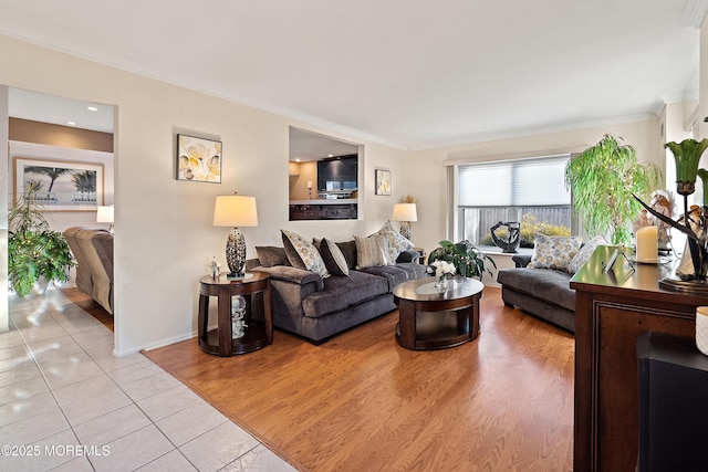 1107 Frontage Rd, Toms River, NJ 08753 - living room featuring light tile patterned flooring, crown molding, and baseboards