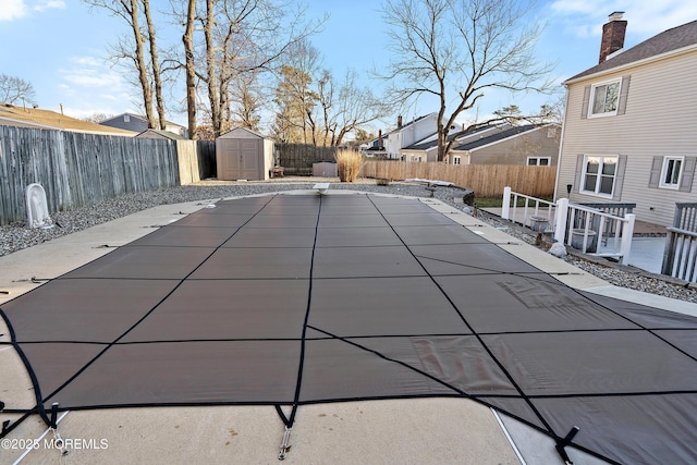 1107 Frontage Rd, Toms River, NJ 08753 - view of swimming pool with a fenced backyard, a storage shed, an outdoor structure, and a patio area