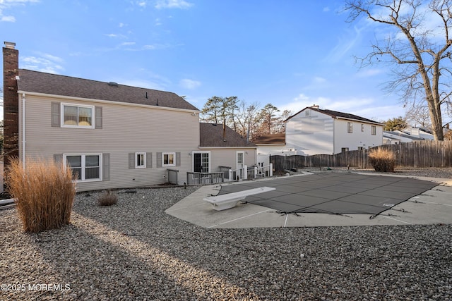 1107 Frontage Rd, Toms River, NJ 08753 - view of pool featuring a patio, a fenced backyard, and a diving board