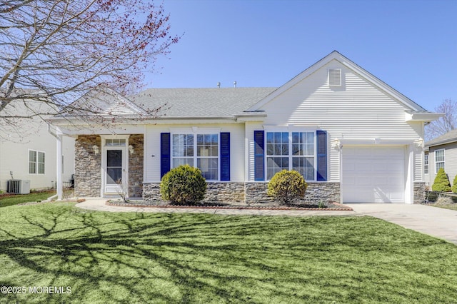 view of front of house featuring central air condition unit, stone siding, concrete driveway, a front yard, and a garage