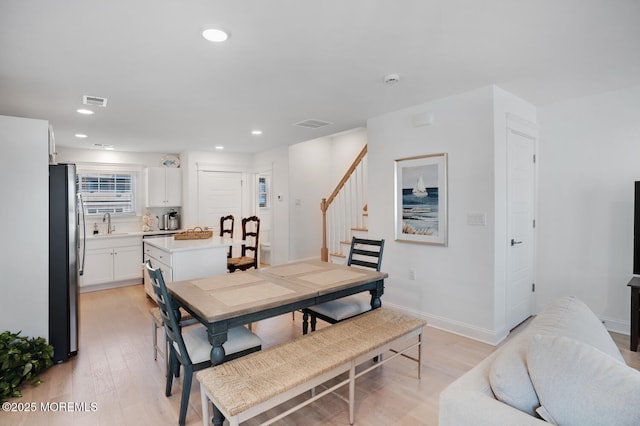 30 Elder St, Mantoloking, NJ 08738 - dining area featuring light wood-style floors, stairway, recessed lighting, and baseboards