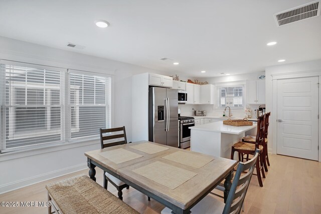 30 Elder St, Mantoloking, NJ 08738 - dining room featuring light wood-style floors, recessed lighting, and baseboards