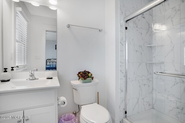 30 Elder St, Mantoloking, NJ 08738 - bathroom featuring toilet, a marble finish shower, and vanity
