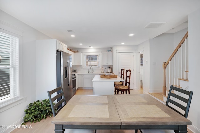 30 Elder St, Mantoloking, NJ 08738 - dining room with baseboards, stairway, light wood-style floors, and recessed lighting