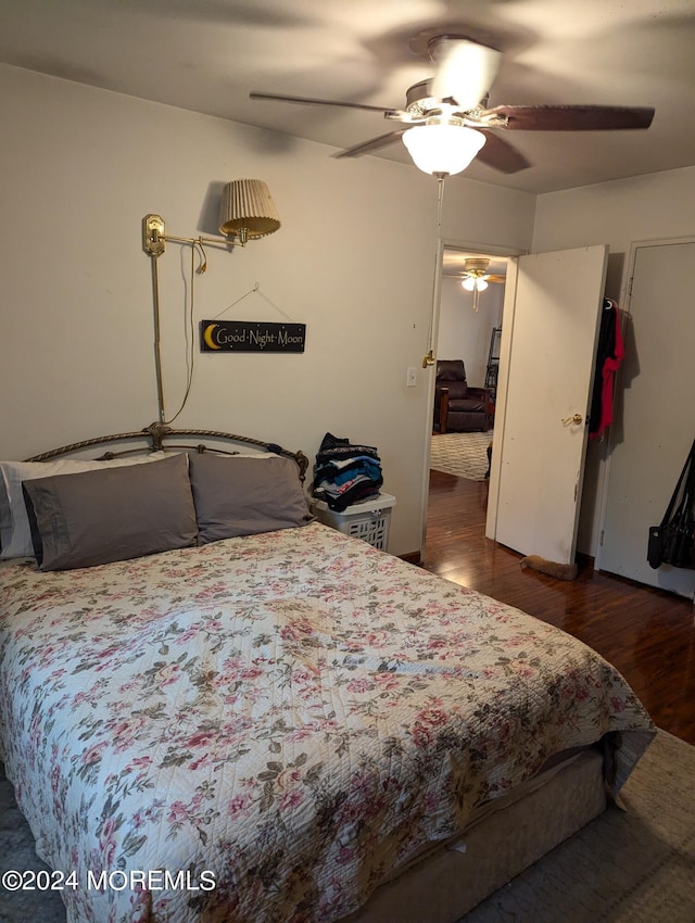 bedroom featuring a ceiling fan and wood finished floors