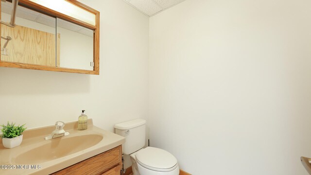 bathroom with toilet and vanity