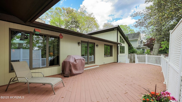 wooden terrace with area for grilling