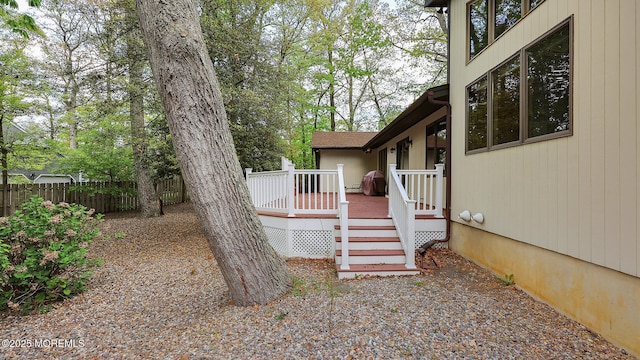view of yard with fence and a deck