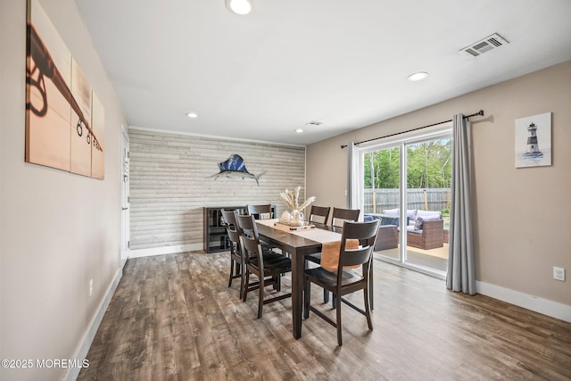 dining space with baseboards, recessed lighting, and wood finished floors