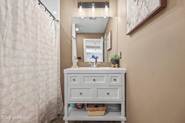full bathroom featuring vanity and a shower with curtain