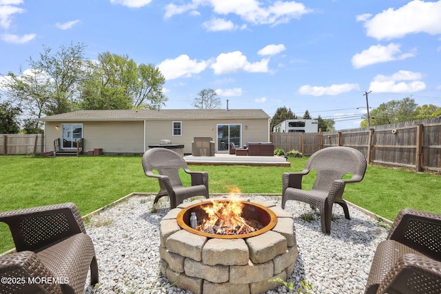 rear view of house featuring an outdoor fire pit and a patio