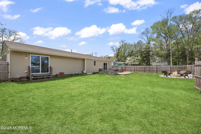 view of yard featuring an outdoor fire pit