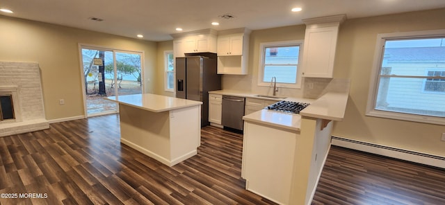 8 Panama Ct, Toms River, NJ 08757 - kitchen featuring a kitchen island, light countertops, appliances with stainless steel finishes, dark wood-style floors, and a sink
