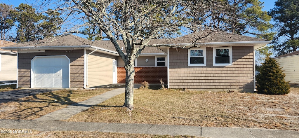 8 Panama Ct, Toms River, NJ 08757 - view of front of home with a front yard, driveway, and roof with shingles