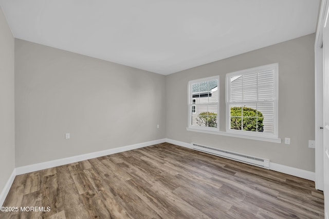 3 Gladstone Ave, Manchester, NJ 08759 - spare room with a baseboard radiator, baseboards, and wood finished floors