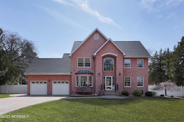 145 Dugan Ln, Toms River, NJ 08753 - view of front of home featuring brick siding, a garage, driveway, and roof with shingles