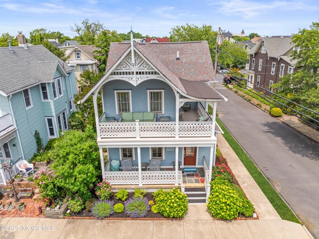 91 Cookman Ave, Ocean Grove, NJ 07756 - victorian home featuring a balcony and covered porch