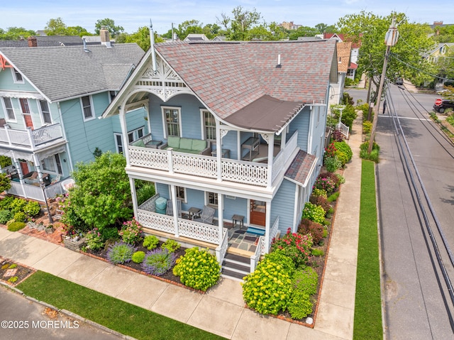 91 Cookman Ave, Ocean Grove, NJ 07756 - victorian-style house featuring a balcony and covered porch