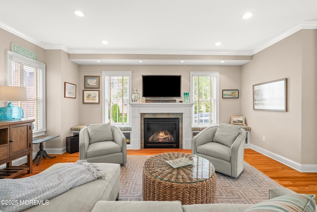 91 Cookman Ave, Ocean Grove, NJ 07756 - living room with ornamental molding, baseboards, light wood finished floors, a glass covered fireplace, and recessed lighting