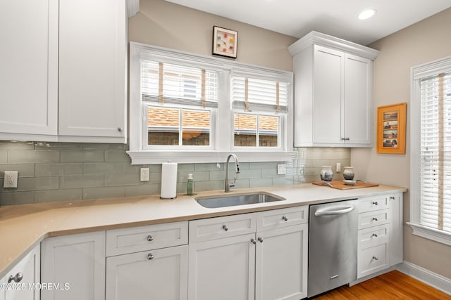 91 Cookman Ave, Ocean Grove, NJ 07756 - kitchen with dishwasher, a sink, white cabinets, decorative backsplash, and recessed lighting