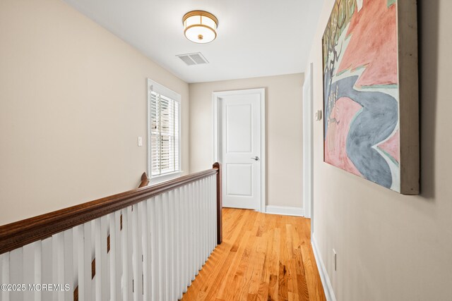 91 Cookman Ave, Ocean Grove, NJ 07756 - hall featuring an upstairs landing, light wood finished floors, and baseboards