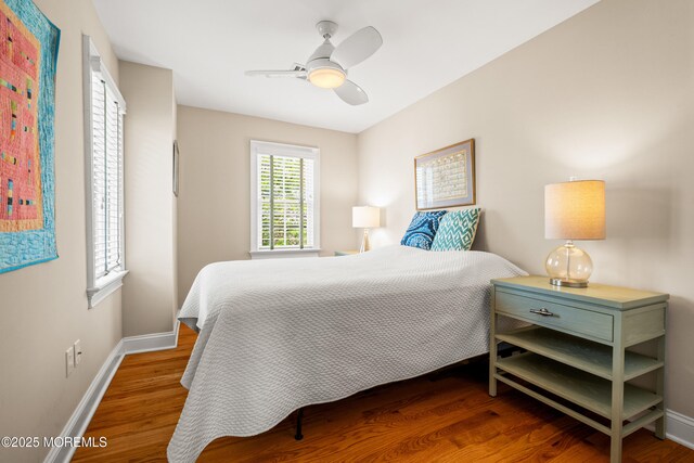 91 Cookman Ave, Ocean Grove, NJ 07756 - bedroom with baseboards, wood finished floors, and a ceiling fan