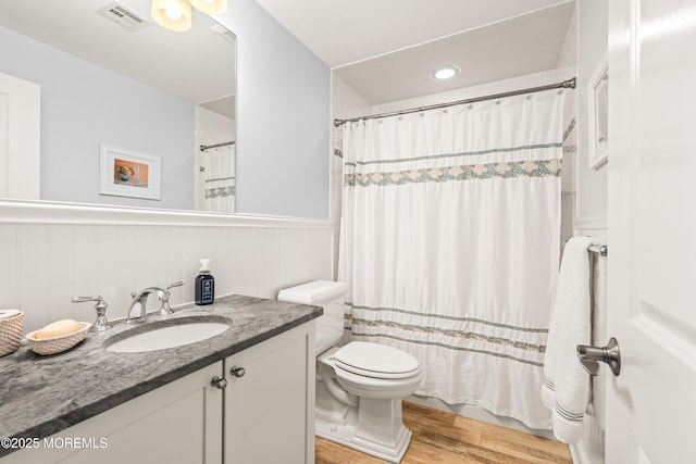 91 Cookman Ave, Ocean Grove, NJ 07756 - bathroom featuring toilet, vanity, a wainscoted wall, wood finished floors, and a shower with curtain