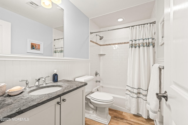 91 Cookman Ave, Ocean Grove, NJ 07756 - bathroom with vanity, wood finished floors, toilet, wainscoting, and shower / tub combo with curtain