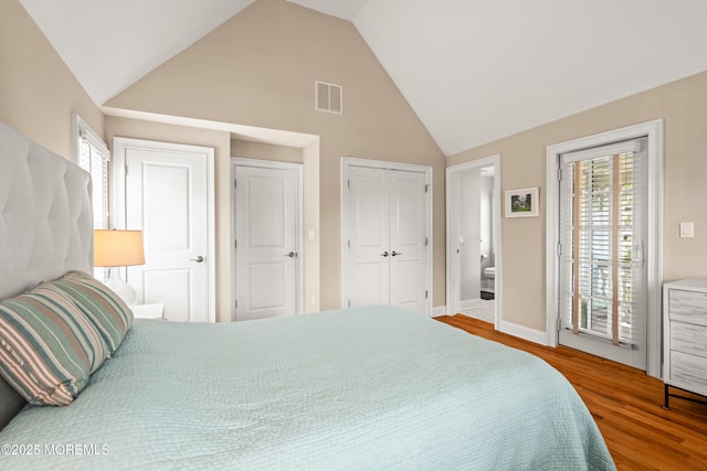 91 Cookman Ave, Ocean Grove, NJ 07756 - bedroom featuring high vaulted ceiling, wood finished floors, multiple windows, baseboards, and ensuite bathroom