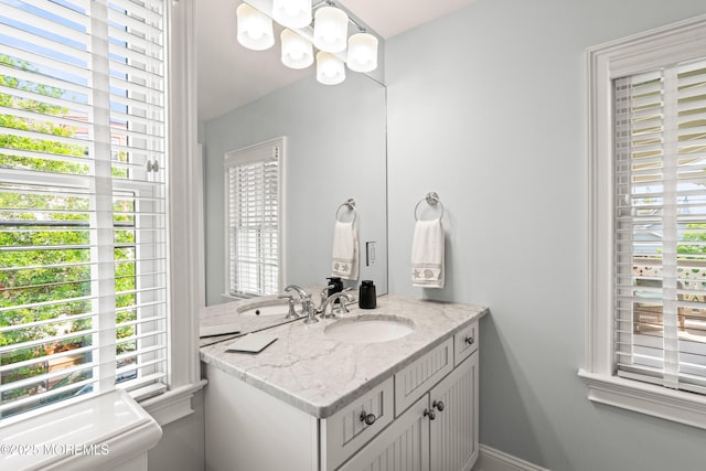 91 Cookman Ave, Ocean Grove, NJ 07756 - bathroom with vanity and a chandelier