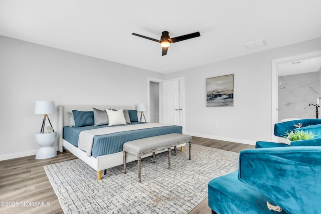 bedroom with wood finished floors, baseboards, and ceiling fan