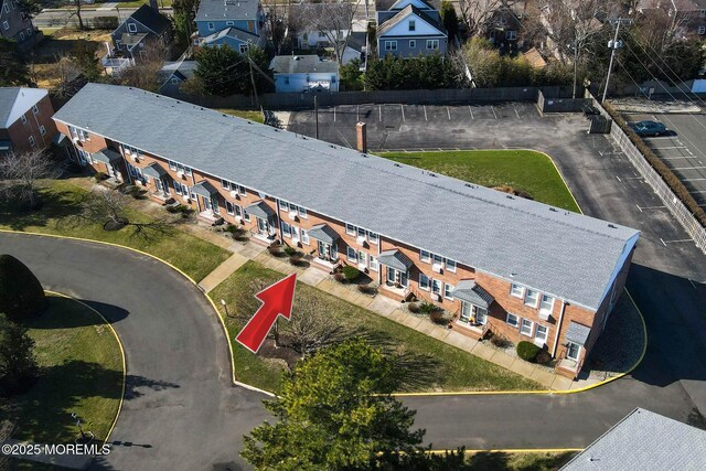 birds eye view of property with a residential view