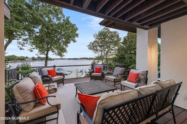 view of patio / terrace featuring a water view and outdoor lounge area