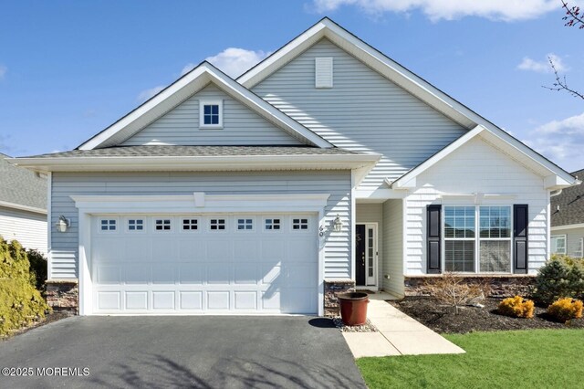 view of front facade with an attached garage and driveway