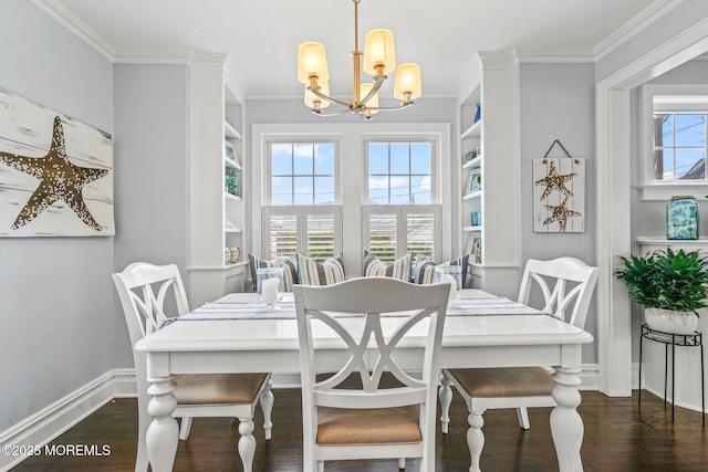 dining space featuring an inviting chandelier, dark wood-type flooring, crown molding, baseboards, and built in features