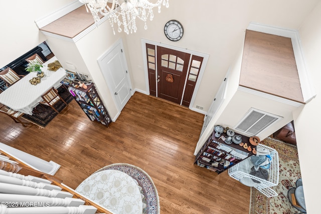 4 Friendship Ln, West Long Branch, NJ 07764 - foyer with a chandelier, wood finished floors, and a high ceiling