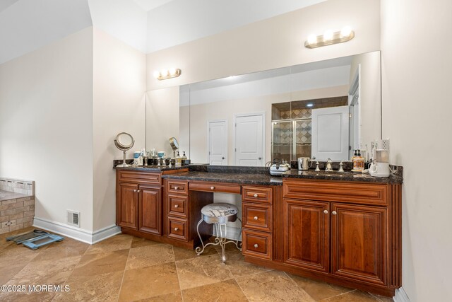 4 Friendship Ln, West Long Branch, NJ 07764 - bathroom with a stall shower, double vanity, and baseboards