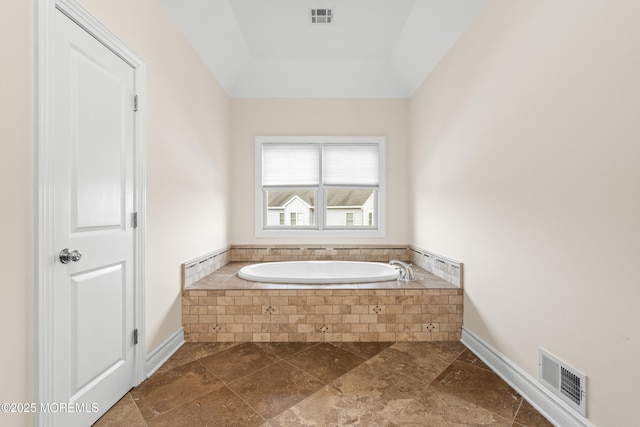 4 Friendship Ln, West Long Branch, NJ 07764 - bathroom with a bath, baseboards, stone finish flooring, and a raised ceiling