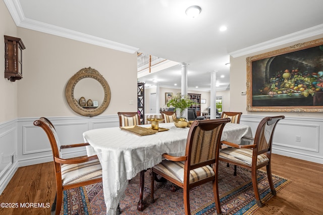 4 Friendship Ln, West Long Branch, NJ 07764 - dining room featuring decorative columns, wood finished floors, crown molding, wainscoting, and a decorative wall