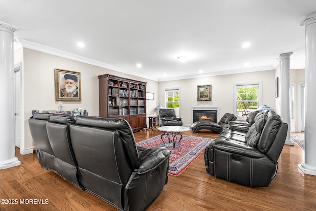 4 Friendship Ln, West Long Branch, NJ 07764 - living room featuring decorative columns, ornamental molding, a glass covered fireplace, recessed lighting, and wood finished floors