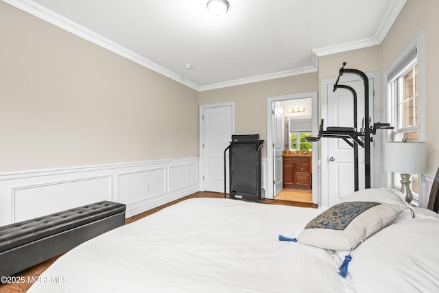 4 Friendship Ln, West Long Branch, NJ 07764 - bedroom featuring ornamental molding, wood finished floors, wainscoting, and ensuite bath