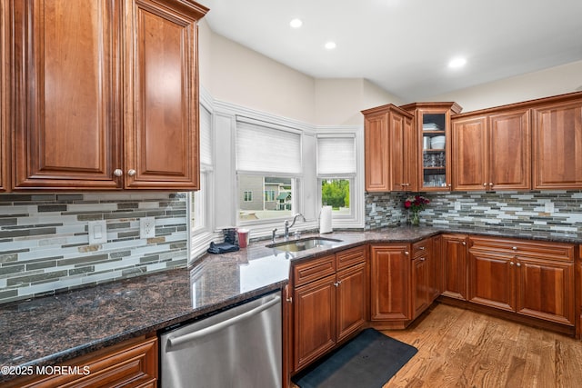 4 Friendship Ln, West Long Branch, NJ 07764 - kitchen featuring stainless steel dishwasher, a sink, light wood-style flooring, brown cabinetry, and decorative backsplash