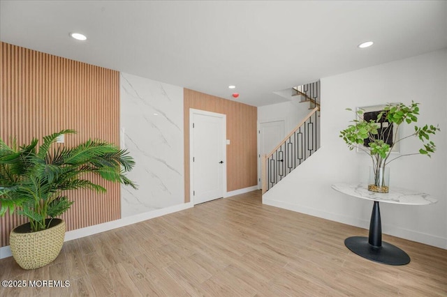 interior space featuring recessed lighting, stairway, and wood finished floors