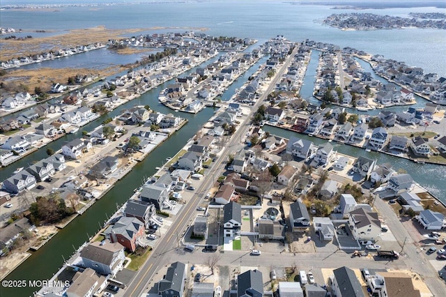 aerial view featuring a water view and a residential view